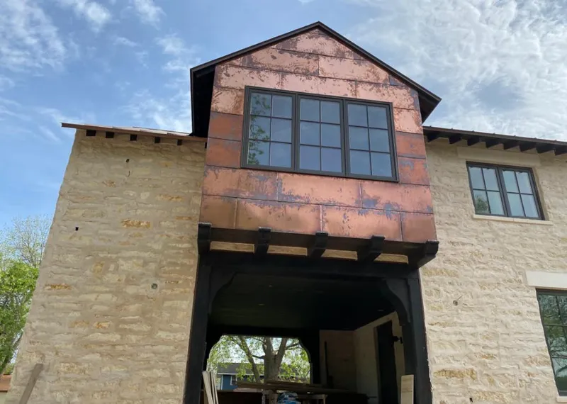 Copper metal panel facade on a stone building for Roof Repair in Nicholasville